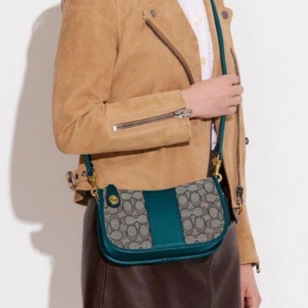 Coach Swinger in signature jacquard with teal color.